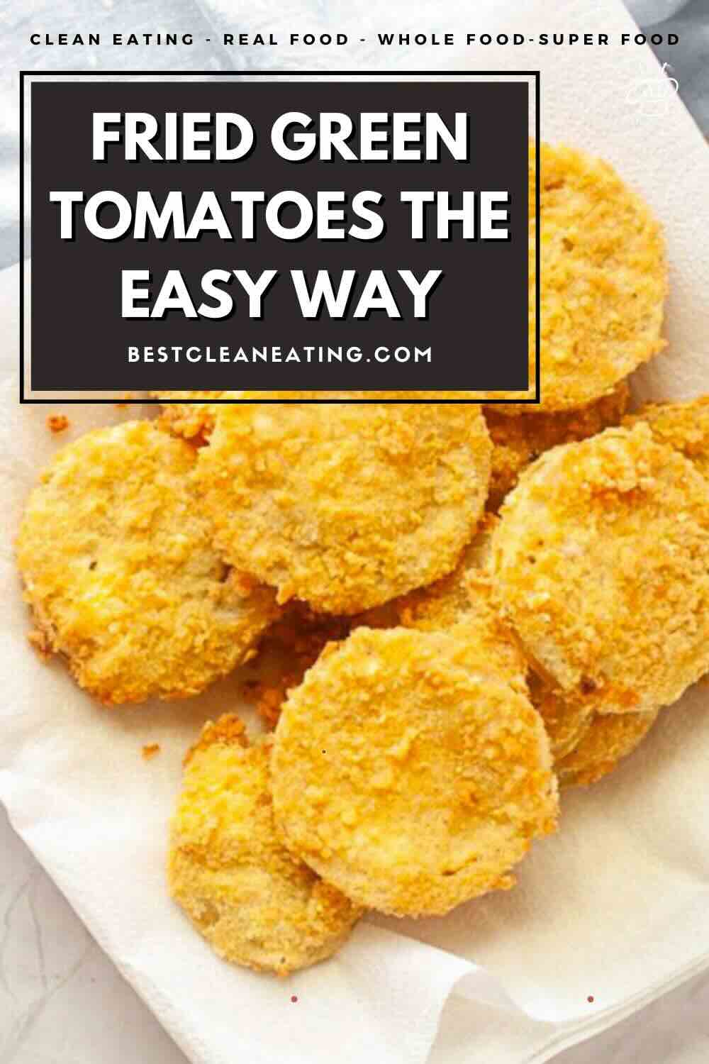 A plate of golden-brown fried green tomato slices on a white paper towel, with a text overlay reading "Fried Green Tomatoes The Easy Way.