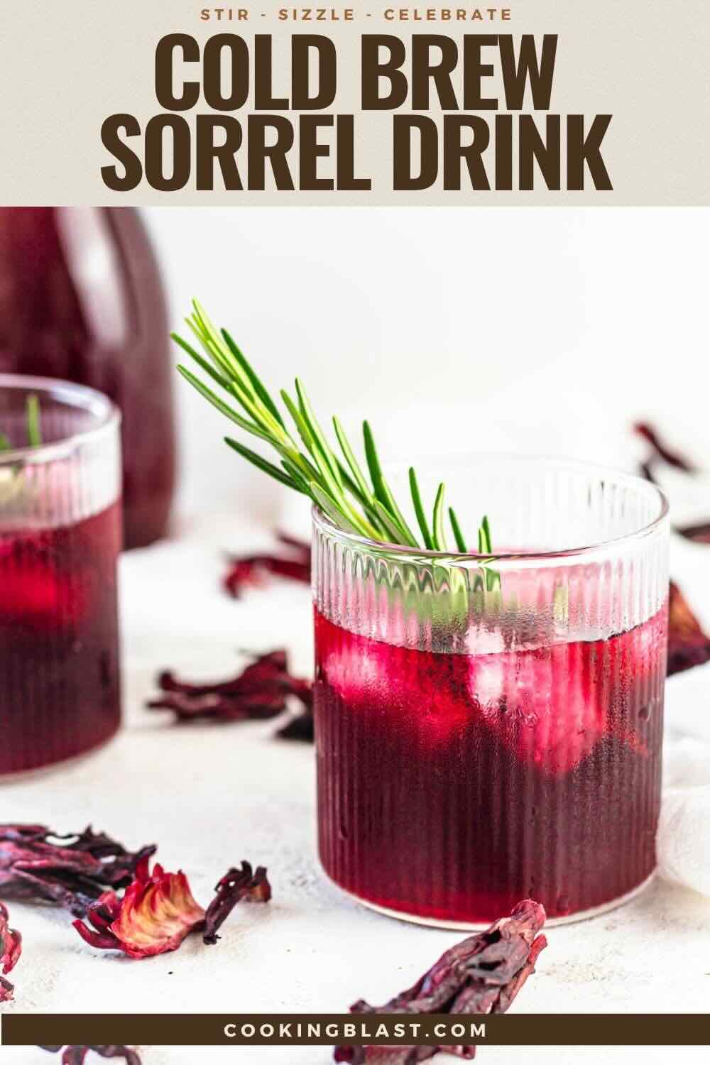 Two glasses of cold brew sorrel drink with ice and rosemary garnish are on a white surface, with dried sorrel petals and a bottle visible in the background.