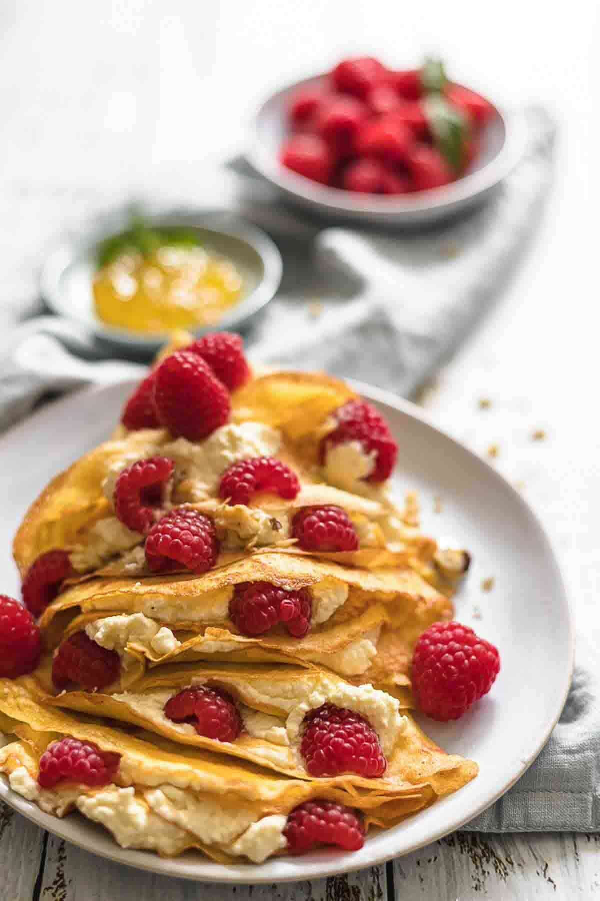 Stack of crepes filled with cream cheese.