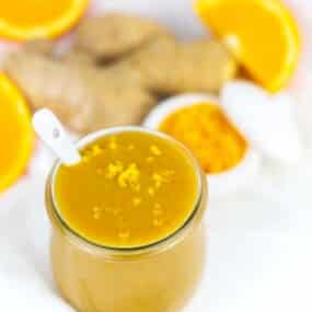 Orange chicken sauce surrounded by ginger ingredients.