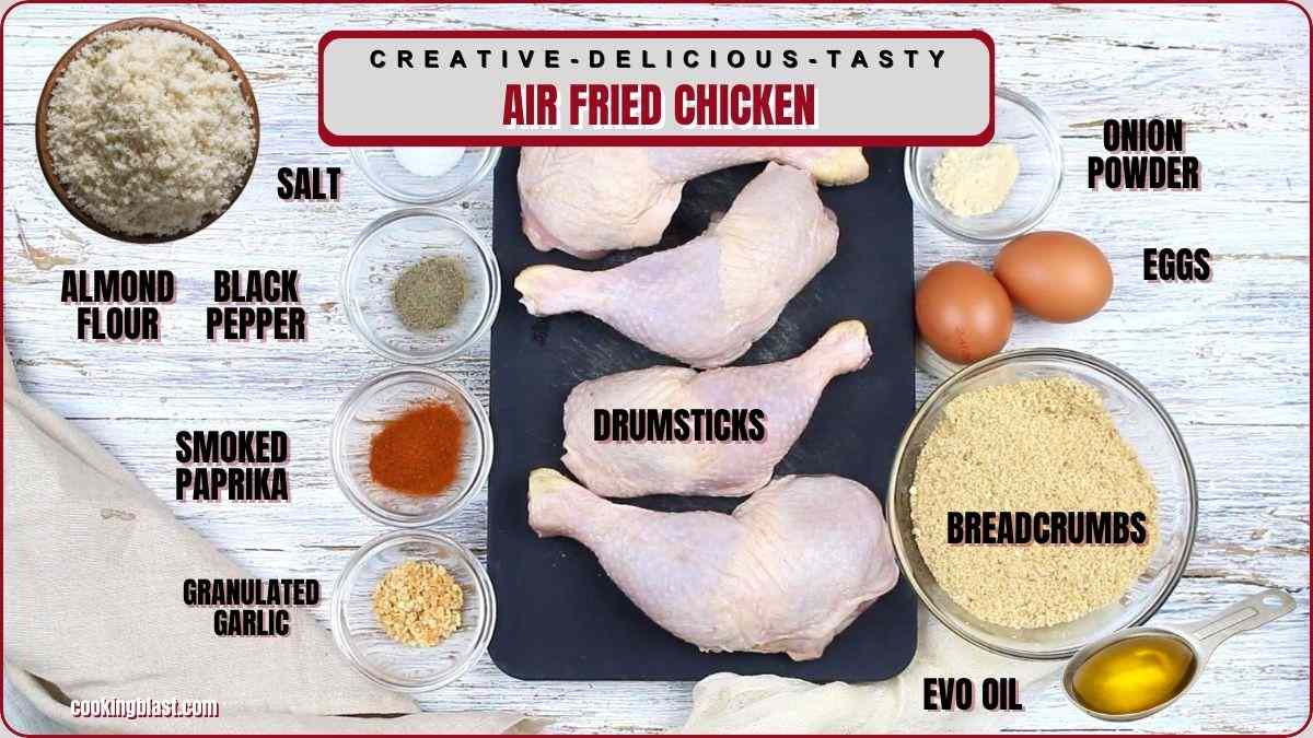 Ingredients for air fried chicken are displayed, including drumsticks, breadcrumbs, eggs, almond flour, salt, black pepper, smoked paprika, granulated garlic, onion powder, and olive oil.