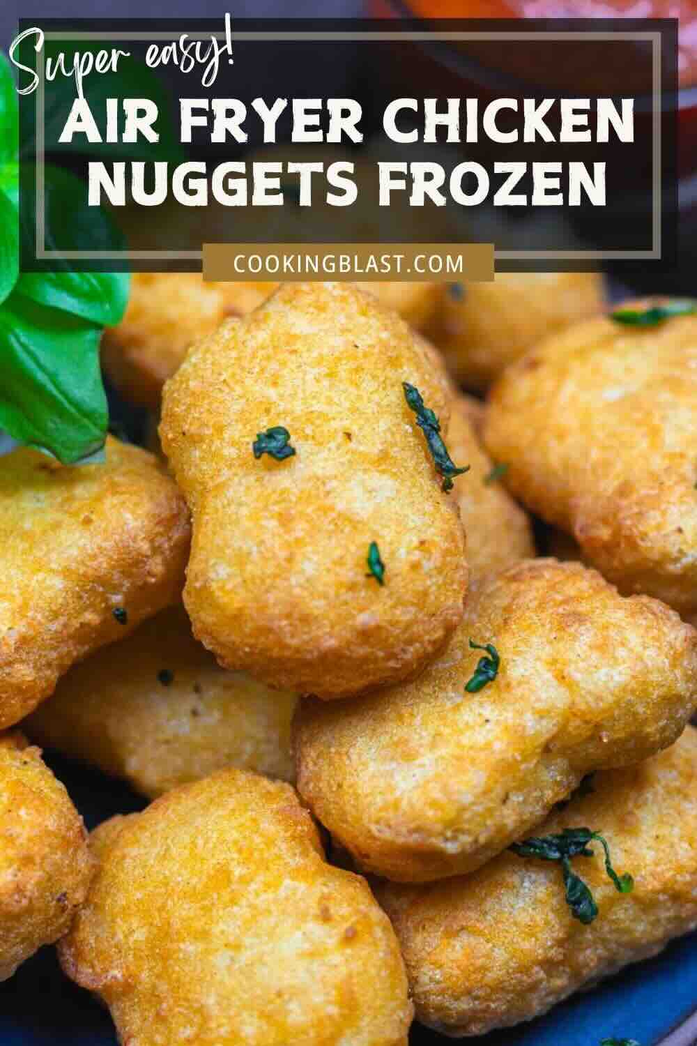 A close-up of golden brown air fryer chicken nuggets garnished with herbs, with text overlay promoting frozen chicken nuggets recipe.