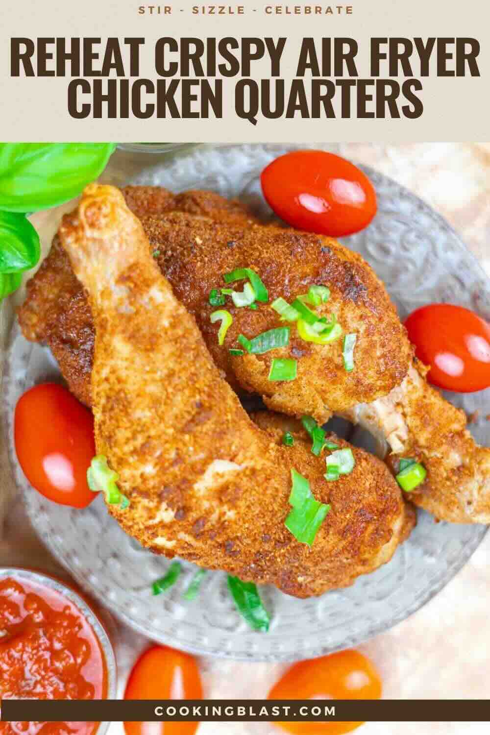 Two seasoned, air-fried chicken quarters on a gray plate, garnished with chopped green onions and surrounded by cherry tomatoes.