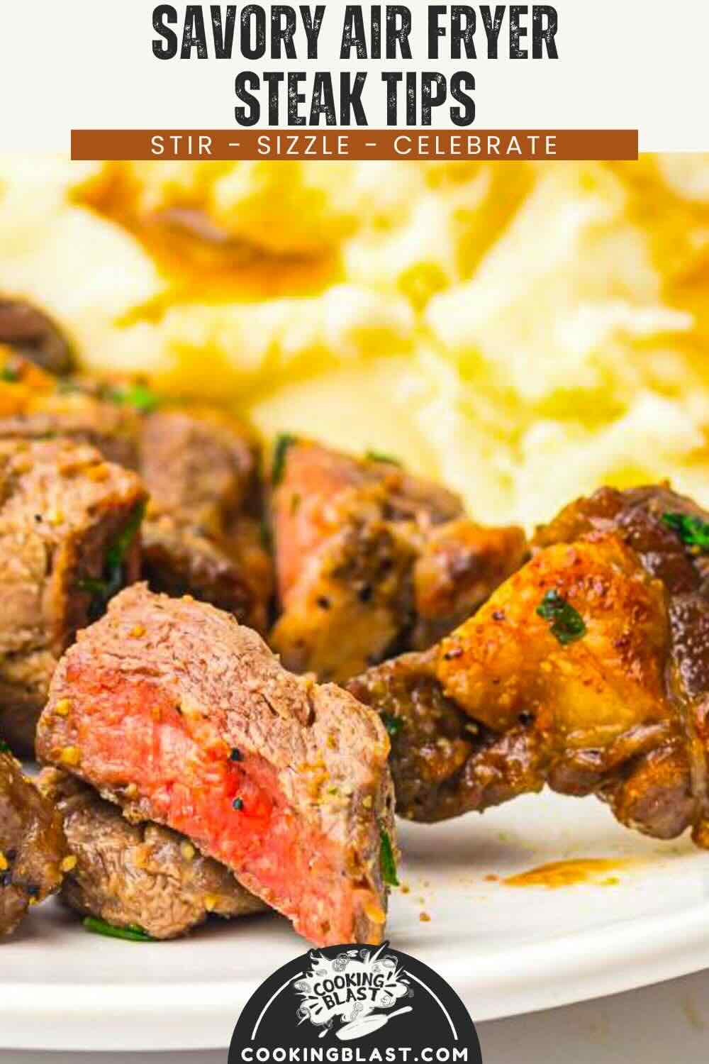 Close-up of air fryer steak tips on a white plate, served with mashed potatoes in the background.